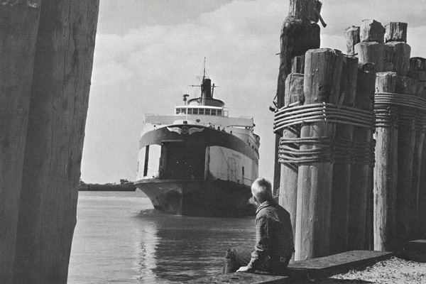 Vintage photo of boy on pier