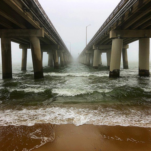 Foggy beaches under the bridge